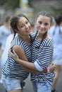 Smiling girls in sailor striped vests relaxing after show. Maidan show