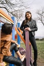 Smiling girls talking in children`s play park Royalty Free Stock Photo