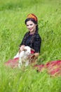 Smiling Glamour Model in Russian Style Kokoshnik Holding Newborn Lamb Cub Against Nature Background Royalty Free Stock Photo