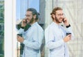 Handsome smiling young man in office clothes is drinking coffee Royalty Free Stock Photo