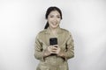 Smiling government worker woman holding her smartphone. PNS wearing khaki uniform