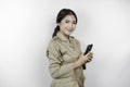 Smiling government worker woman holding her smartphone. PNS wearing khaki uniform