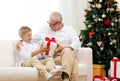 Smiling grandfather and grandson at home Royalty Free Stock Photo