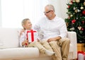 Smiling grandfather and grandson at home Royalty Free Stock Photo