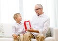 Smiling grandfather and grandson at home Royalty Free Stock Photo