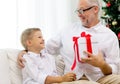 Smiling grandfather and grandson at home Royalty Free Stock Photo