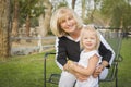 Smiling Grandmother and Granddaughter Playing At The Park Royalty Free Stock Photo