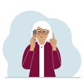 Smiling grandmother talking on a cell phone with emotions. One hand with the phone the other with a forefinger up