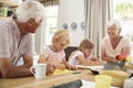 Smiling grandparents with grandkids in the kitchen, close up Royalty Free Stock Photo