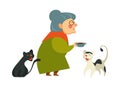 Smiling granny holding a bowl with food for her two cats