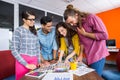 Smiling graphic designers working over photos at desk Royalty Free Stock Photo