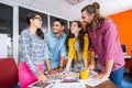 Smiling graphic designers working over photos at desk Royalty Free Stock Photo