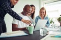 Smiling group of businesspeople working together on an office la Royalty Free Stock Photo