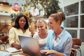 Smiling group of businesswomen working together in a lounge Royalty Free Stock Photo