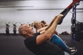 Smiling people using resistance bands during a gym class Royalty Free Stock Photo