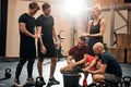 Smiling group of people chalking their hands at the gym Royalty Free Stock Photo