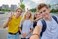 Smiling group of teenagers taking selfie, happy four teens looking at camera Royalty Free Stock Photo
