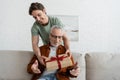 smiling guy holding fathers day present Royalty Free Stock Photo