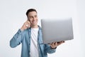 Smiling guy with phone and laptop, copy space Royalty Free Stock Photo