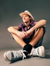 Smiling guy in sneakers and hat Royalty Free Stock Photo