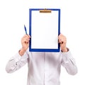 Smiling guy in white clothes on a white background looks at the camera and shows an empty palm. Cheerful young man in Royalty Free Stock Photo