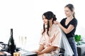 smiling hairstylist fixating veil