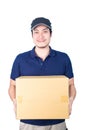Smiling handsome asian delivery man giving and carrying parcel o Royalty Free Stock Photo