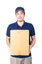 Smiling handsome asian delivery man giving and carrying parcel o Royalty Free Stock Photo