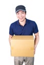 Smiling handsome asian delivery man giving and carrying parcel o Royalty Free Stock Photo