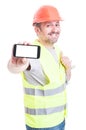 Smiling handsome builder holding phone and thumb up