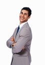 Smiling handsome business man. Portrait of happy young business man smiling with hands folded on white background. Royalty Free Stock Photo