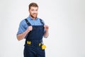 Smiling handsome male builder looking at camera Royalty Free Stock Photo