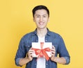 Smiling Handsome man  holding gift box Royalty Free Stock Photo