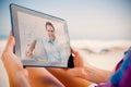 Smiling handsome man sitting on the couch looking at camera Royalty Free Stock Photo