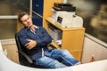 Smiling handsome young businessman sitting at desk Royalty Free Stock Photo