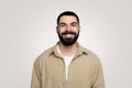 Smiling handsome young latin guy with a beard in casual looking at camera Royalty Free Stock Photo