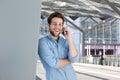 Smiling handsome young man talking on cell phone Royalty Free Stock Photo