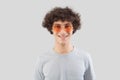 Smiling and handsome, the young man wears sunglasses. He looks into the camera with his eyes, a portrait of a man with orange lens Royalty Free Stock Photo