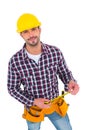 Smiling handyman holding tape measure Royalty Free Stock Photo