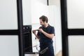 smiling handyman repairing inbuilt electric oven Royalty Free Stock Photo