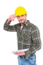 Smiling handyman writing on clipboard Royalty Free Stock Photo