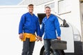 Smiling handymen looking at camera