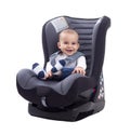 Smiling happy adorable baby sitting in car seat Royalty Free Stock Photo
