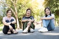 Smiling happy asian family spending good time at the park together,enjoying in outdoor summer nature,joyful grandmother, mother,