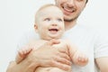 Smiling happy baby in father`s hand. Little enfant toddler