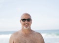 Smiling Happy Bald Man Wearing Sunglasses on the Beach in Mexico Royalty Free Stock Photo