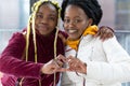 Smiling happy black girl friends, african american homosexual women, afro lesbians couple make heart shape symbol in hands Royalty Free Stock Photo