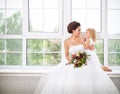 Smiling happy bride and a flower indoors