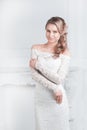 Smiling happy bride trying on wedding dress Royalty Free Stock Photo