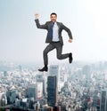 Smiling happy businessman jumping Royalty Free Stock Photo